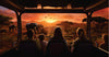 People in a safari vehicle observing elephants in a sunset savanna landscape on Masai Mara budget game drive adventure